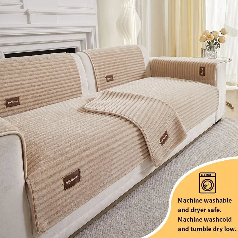A beige minimalist anti-slip sofa cushion with ribbed fabric and care instructions is shown on a light-colored sofa.