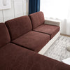 A dark brown jacquard sofa cushion cover in a leaf pattern displayed on a white sofa.