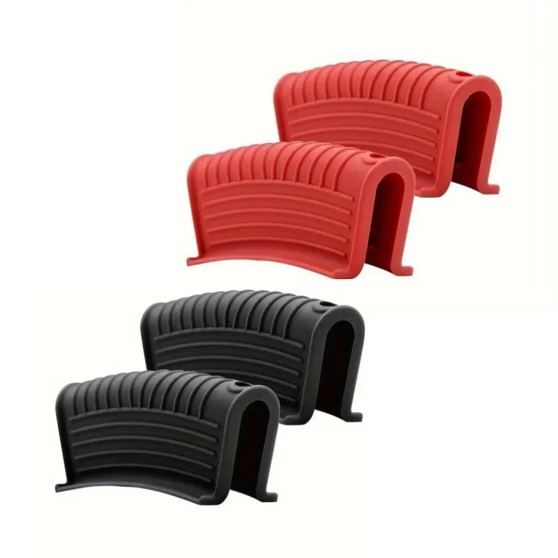 Two silicone pot handle covers, one red and one black, shown from the side.