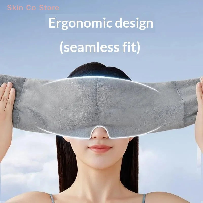 A woman is wearing a gray seamless ergonomic design sleep mask for deep relaxation.