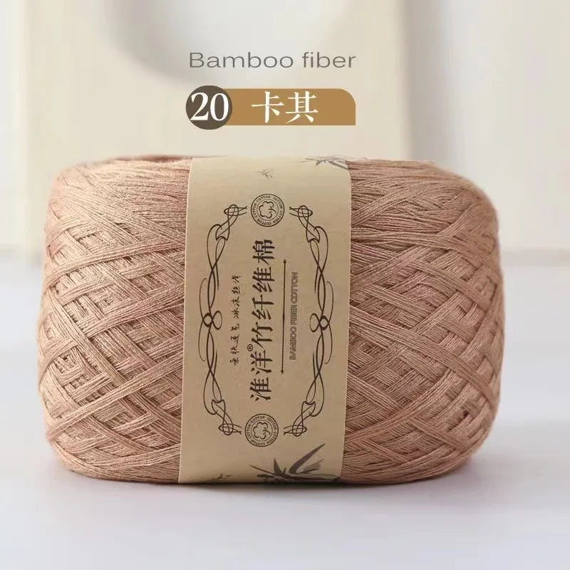 A ball of beige bamboo fiber yarn with a label indicating 20 skeins for crafting.