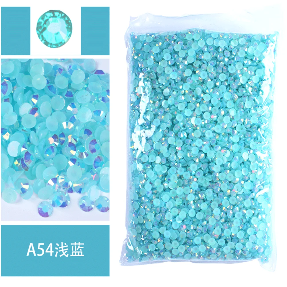 Bag of light blue iridescent resin rhinestones and small clear crystals.