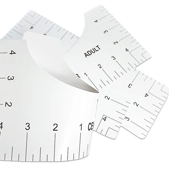 A set of white T-shirt alignment rulers showing various measurements and markings.