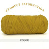 A skein of thick, golden yellow polyester blended yarn is shown rolled up against a white background.