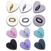 A collection of metal heart-shaped phone charm connectors in various colors including gold, silver, purple, and black.