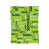 A green fabric blanket featuring repeated text in yellow and black, including words like Seriously, Really, Why, and Uhhhg.