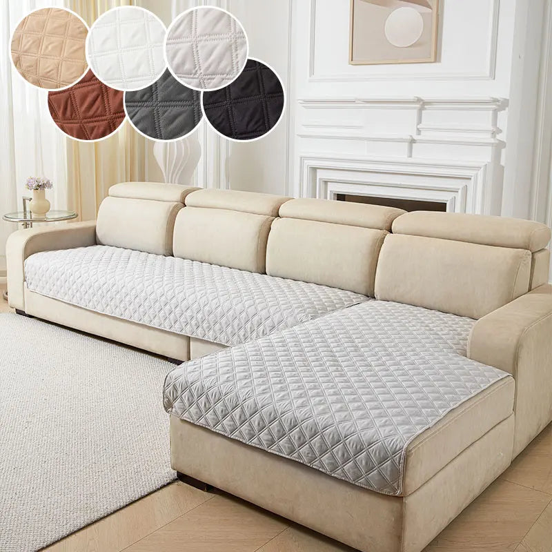 A beige anti-slip sofa cushion cover displayed on a light-colored sofa with matching decorative pillows.