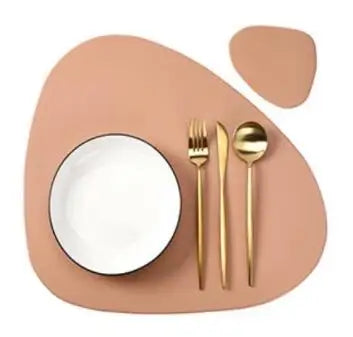 A beige vinyl placemat with a white plate and silverware set on a wooden surface.