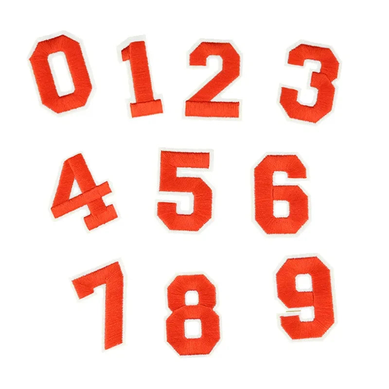 A set of customizable number patches in orange fabric showing digits zero through nine.