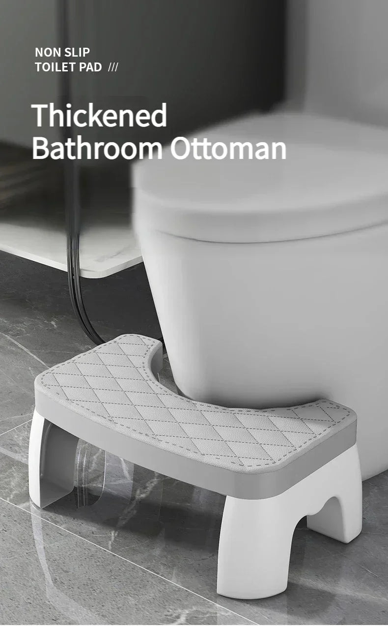 A white thickened bathroom ottoman or toilet pad used as a stool for comfort.