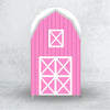 A pink wooden barn-style arch backdrop cover with white cross patterns for events.