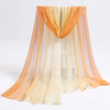 Montessori sensory play scarves in shades of peach and cream draped for display