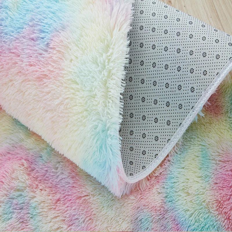 Rainbow plush area rug with pastel colors and a perforated section visible
