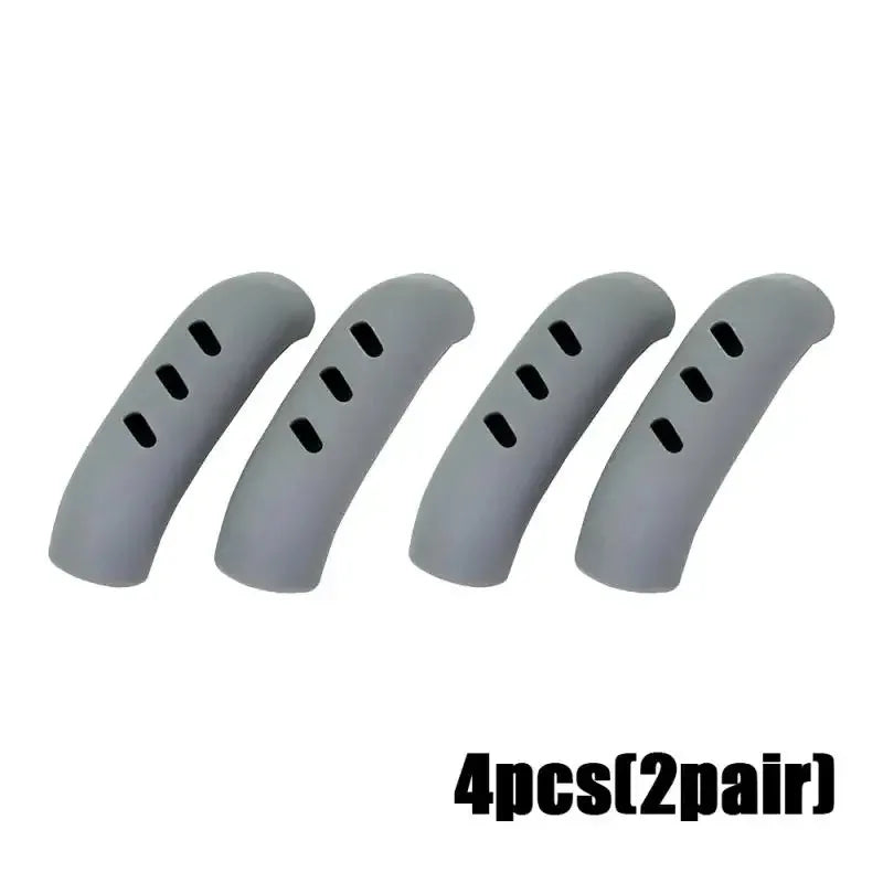 Four gray silicone pan handle covers for heat resistant pot handle protection