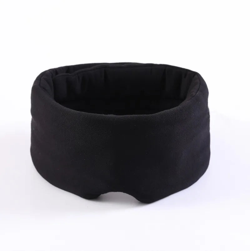A black contoured travel sleep mask with a neck pillow design.