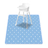 A white baby play mat with a wooden stool placed on it, featuring a light blue pattern of crescent moons.