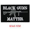 Black embroidered patch with the text BLACK GUNS MATTER on a dark background.