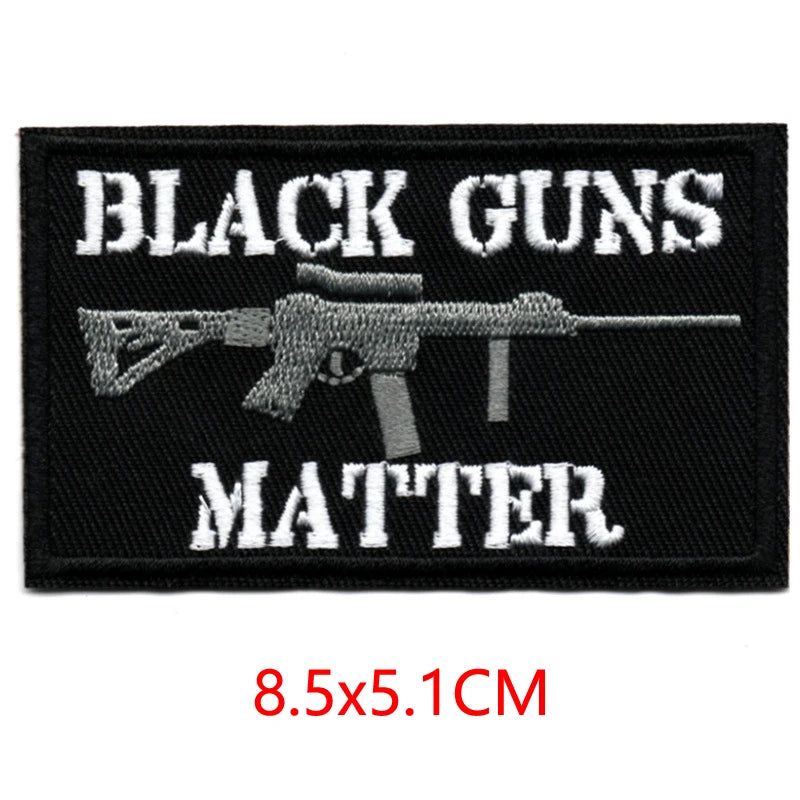 Black embroidered patch with the text BLACK GUNS MATTER on a dark background.