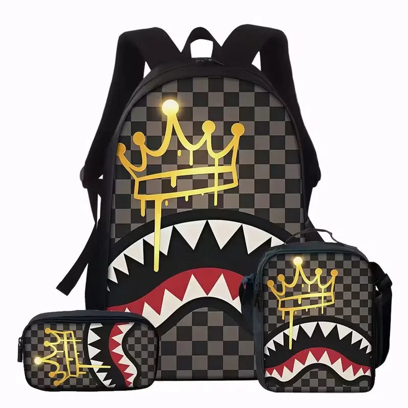A black backpack featuring a gold crown and a fierce tiger tooth graphic print on a checkered pattern.