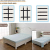 Four black adjustable straps used to fasten bed sheets on a white wooden bed frame.