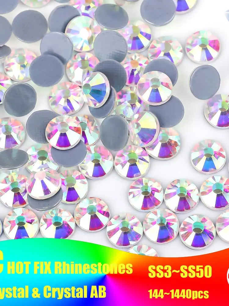 A collection of iridescent crystal AB flatback rhinestones in various shades and sizes.