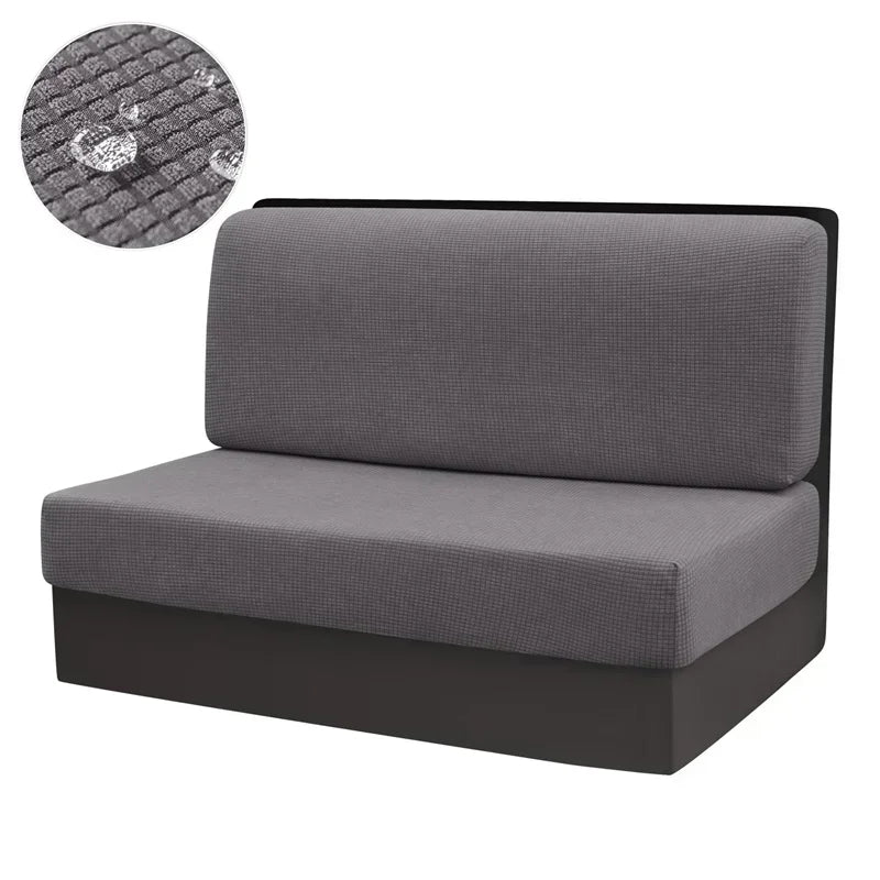 A gray stretch sofa and chair cover with a textured fabric detail shown next to the product.