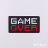 Black embroidery patch with white GAME and red OVER text on a white background
