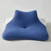 A navy blue ergonomic wedge pillow with a white trim, shown from the side.