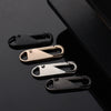 A collection of various metal and plastic zipper slider puller repair tools displayed against a dark background.