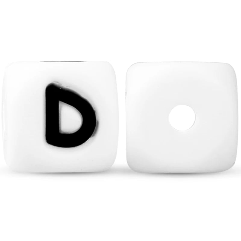A pair of white silicone alphabet beads, one showing the letter D and the other blank.