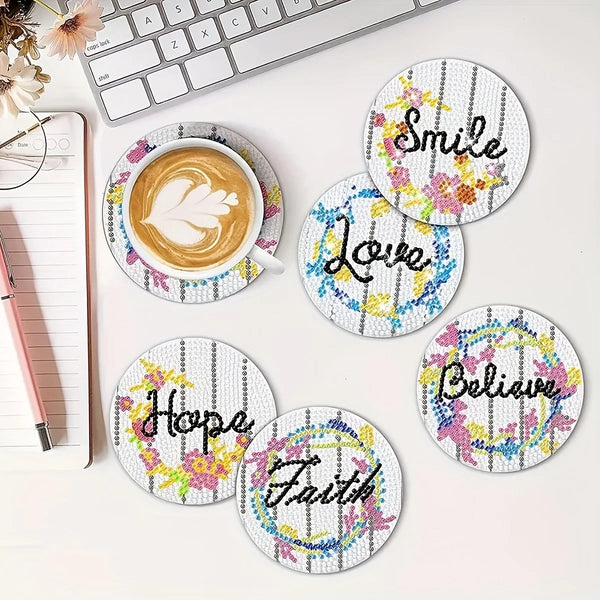 Eight diamond painting coasters featuring words like Smile, Love, Hope, Faith, and Believe on a white background