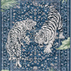 A blue rug featuring a detailed pattern of two tigers, one striped and one with a mane.