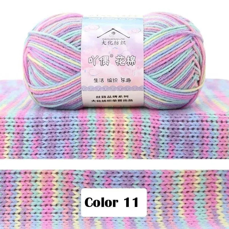 A ball of pink and purple gradient yarn labeled as 4-Ply Cotton Knit Yarn for Gradient Projects.