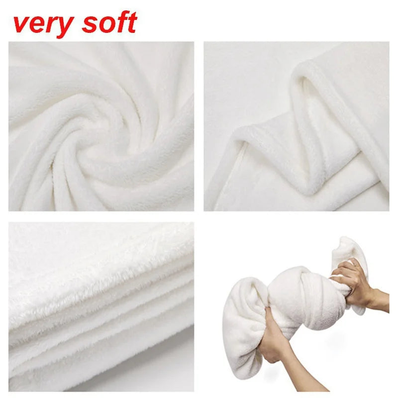 A close-up of a very soft white flannel throw blanket being rolled and shown in various textures.