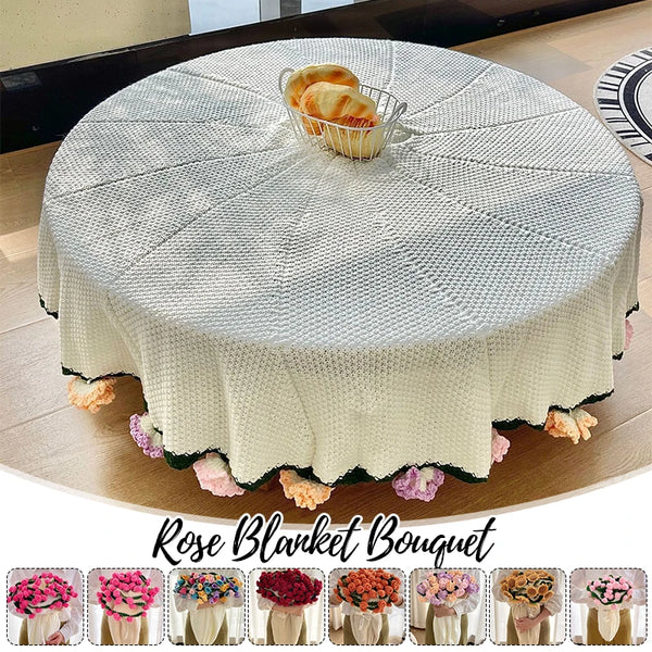 A hand knitted floral rose bouquet throw blanket displayed on a round table.
