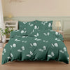 A dark teal duvet cover set featuring a white butterfly print on a bed.