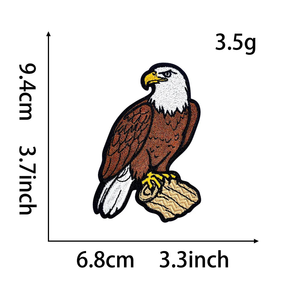 An embroidery patch depicting a bald eagle with a yellow beak and gold accents.
