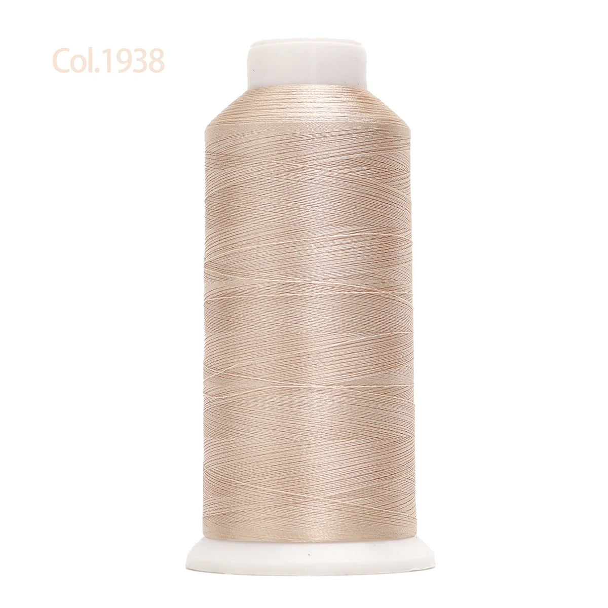 A spool of beige high tenacity machine embroidery thread labeled Col.1938.