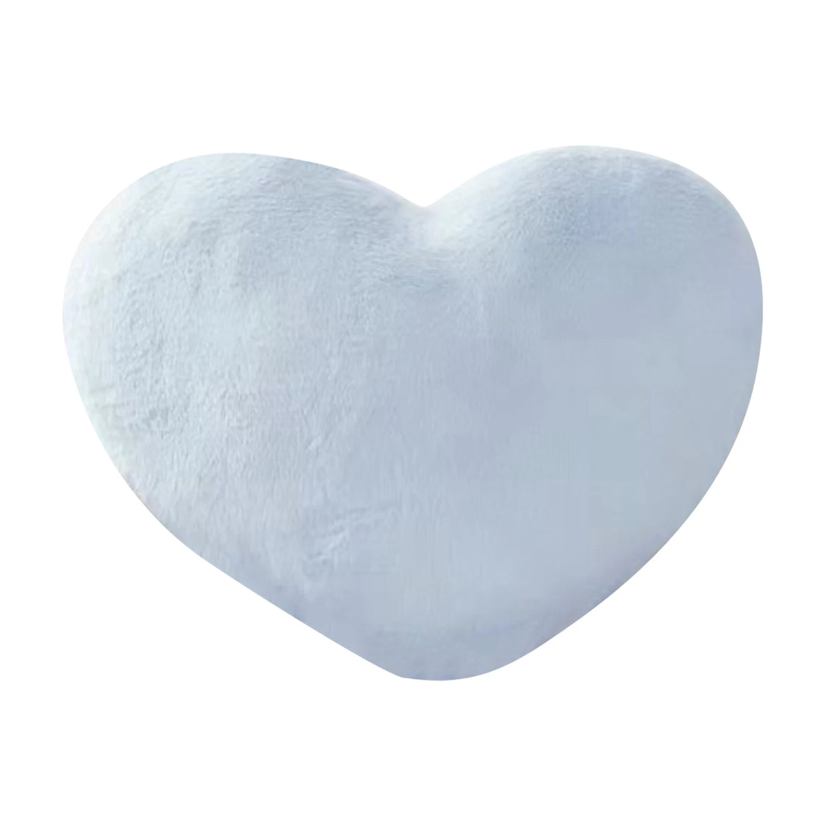 A soft, white heart-shaped throw pillow.