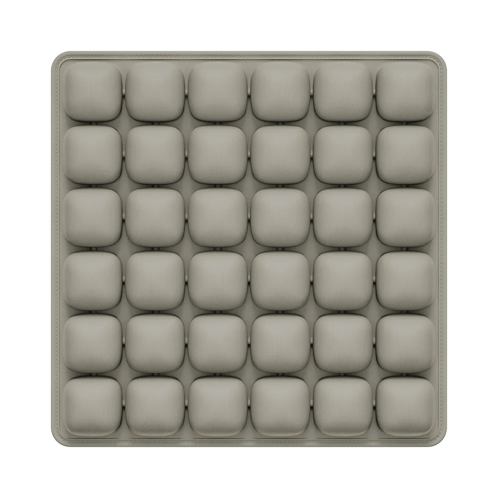 A gray, square seat cushion with multiple individual air pockets for adjustable pressure relief.