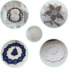 A collection of embroidery stabilizers, including a purple floral wreath, a white star pattern, and lace embroidery pieces.