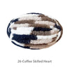 A round, hand-knitted yarn in a striped pattern of brown, white, and dark blue, named 26-Coffee Skilled Heart.