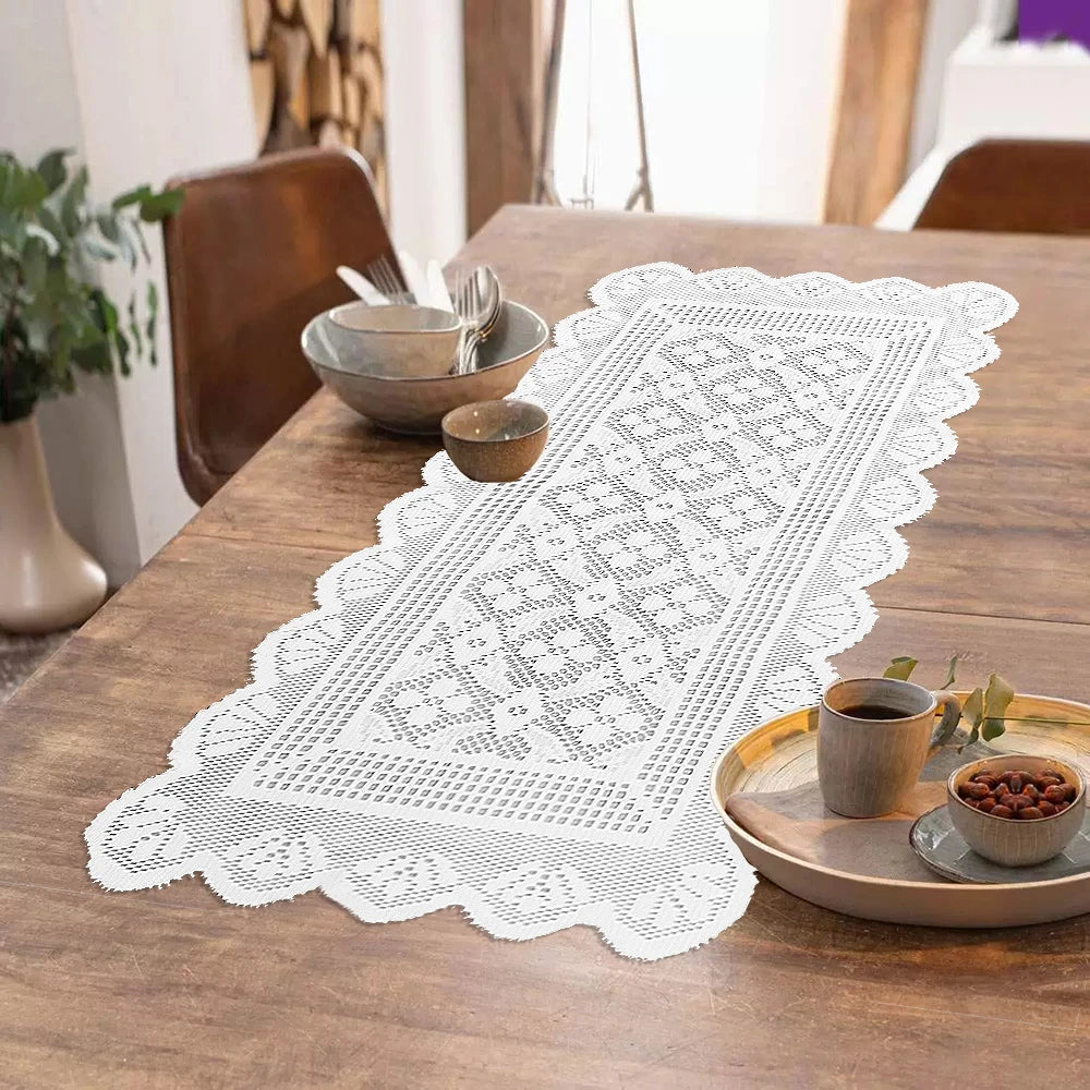 White lace table runner with a geometric pattern placed on a wooden table next to small bowls.