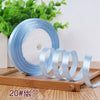 Rolls of light blue satin ribbon for crafting and decoration
