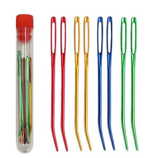 A set of bent tip tapestry needles in various colors including red, green, and blue.