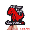 Red embroidered dinosaur patch with black outline and text