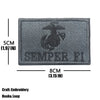 A gray embroidered patch featuring a trident design and the text SEMPER FI