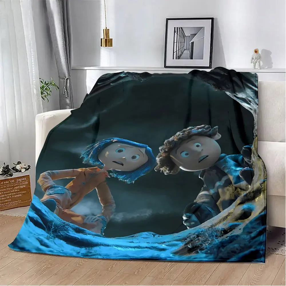 An animated print blanket featuring two stylized children looking out from a dark, watery background.