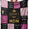 A black and pink knit blanket featuring inspirational quotes about motherhood and love.
