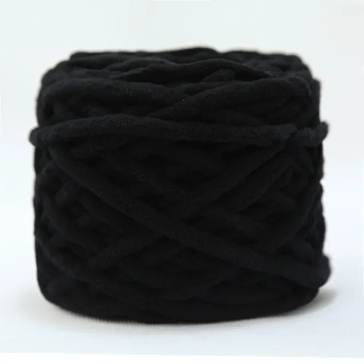 A ball of black soft chenille knitting yarn for hand crafting